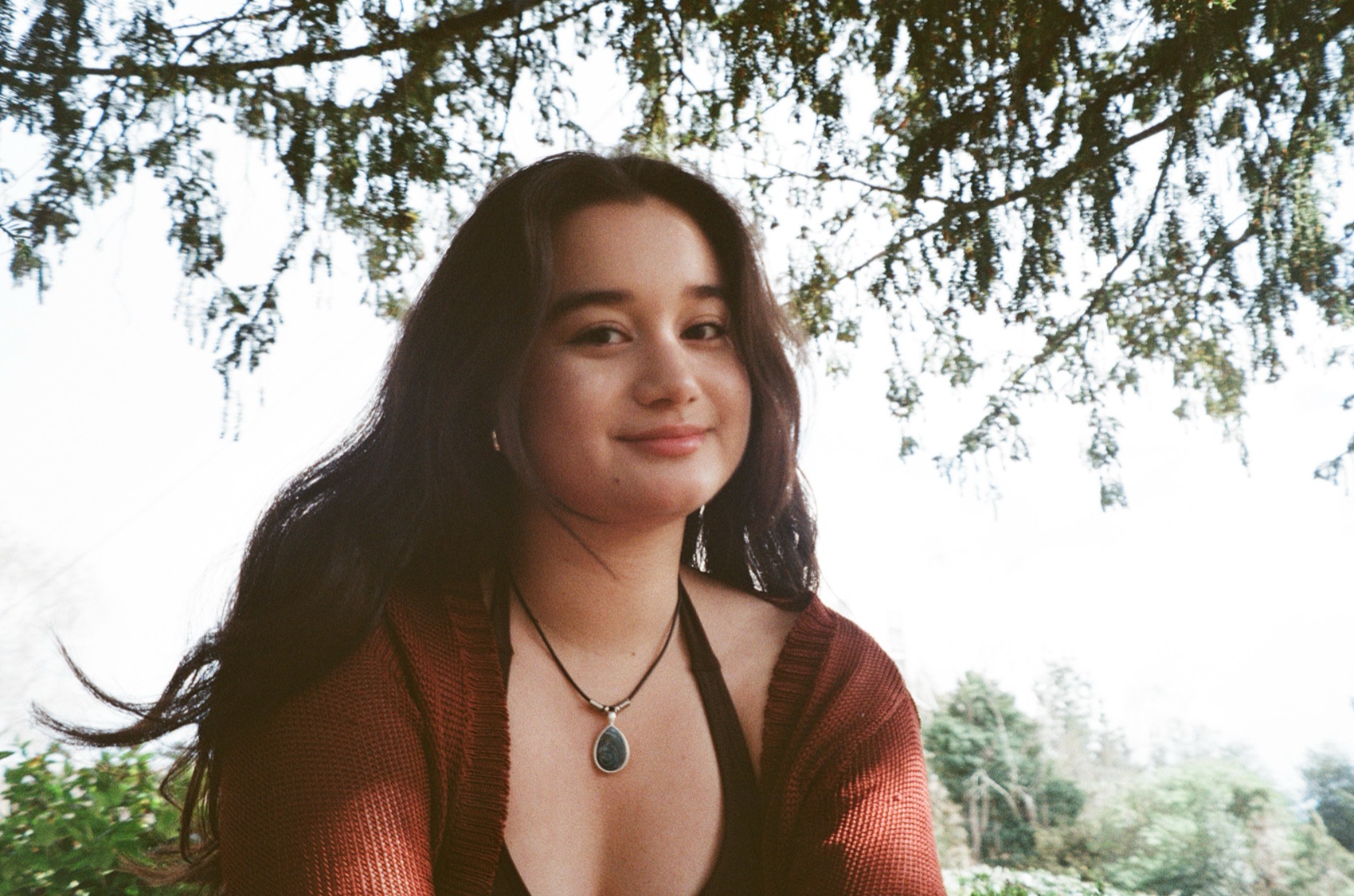 Clarissa Mae under tree branches
