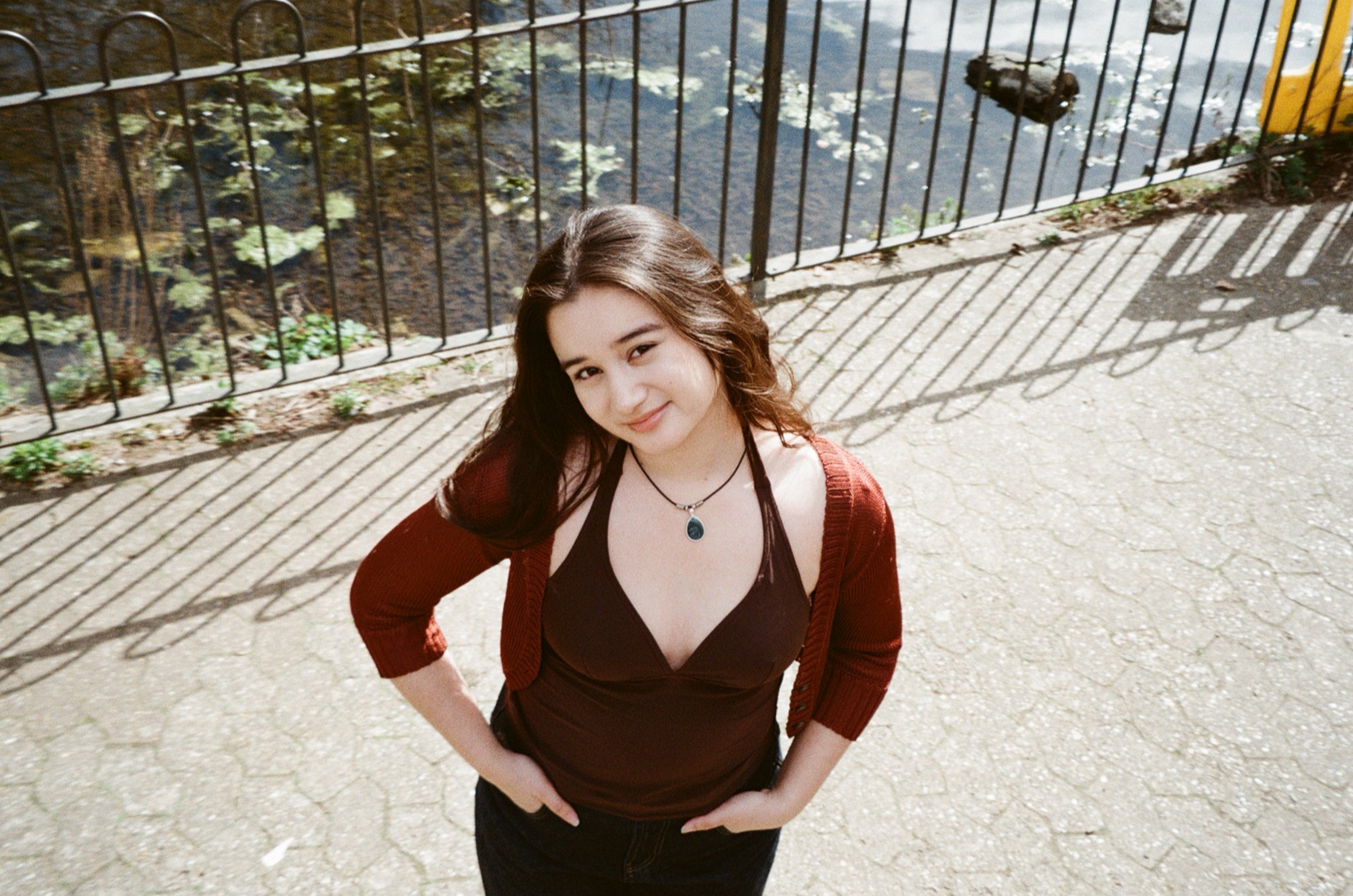 Clarissa Mae smiling near water and railings